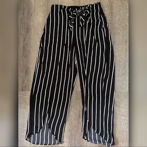 Black striped high waist flare pants.